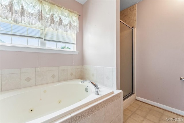 135 Hobbs Hole Ln, Tappahannock, VA 22560 - bathroom with a jetted tub, a shower stall, and tile patterned floors