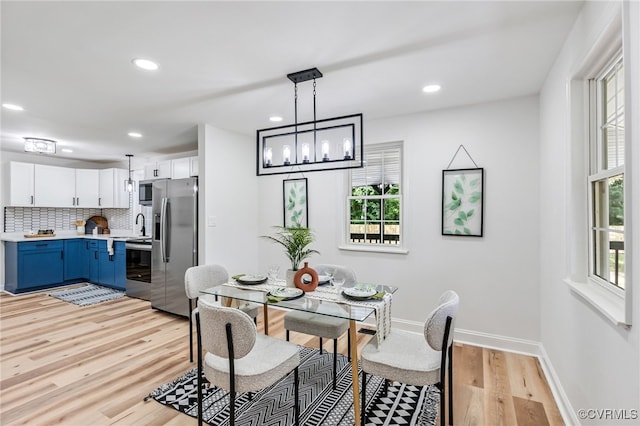 5318 Pine Hill Rd, Sutherland, VA 23885 - dining space with plenty of natural light, light wood finished floors, recessed lighting, and a chandelier