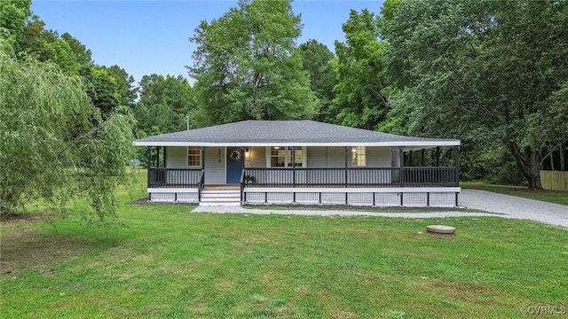 5318 Pine Hill Rd, Sutherland, VA 23885 - view of front of house featuring a porch, a front lawn, and a view of trees