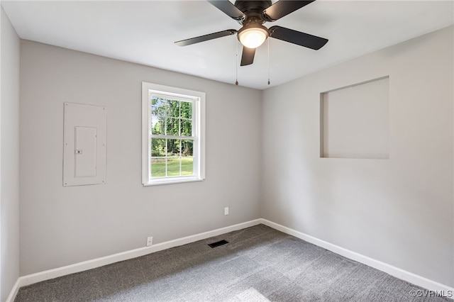 5318 Pine Hill Rd, Sutherland, VA 23885 - unfurnished room featuring electric panel, carpet floors, and a ceiling fan