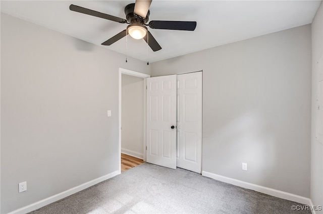 5318 Pine Hill Rd, Sutherland, VA 23885 - unfurnished bedroom with carpet flooring, a closet, and a ceiling fan