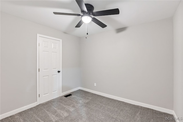 5318 Pine Hill Rd, Sutherland, VA 23885 - spare room with dark colored carpet and ceiling fan