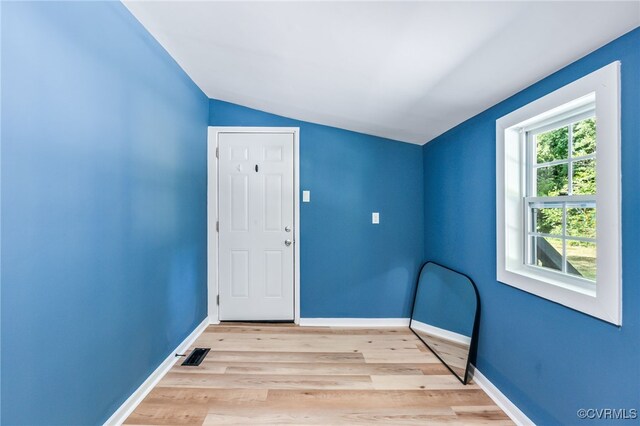5318 Pine Hill Rd, Sutherland, VA 23885 - unfurnished room with vaulted ceiling and light wood-type flooring
