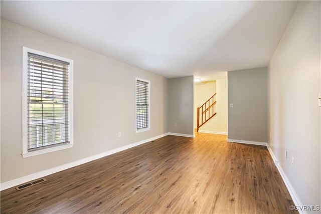 11556 New Forest Trl, Chesterfield, VA 23112 - empty room featuring healthy amount of natural light, wood finished floors, and stairway