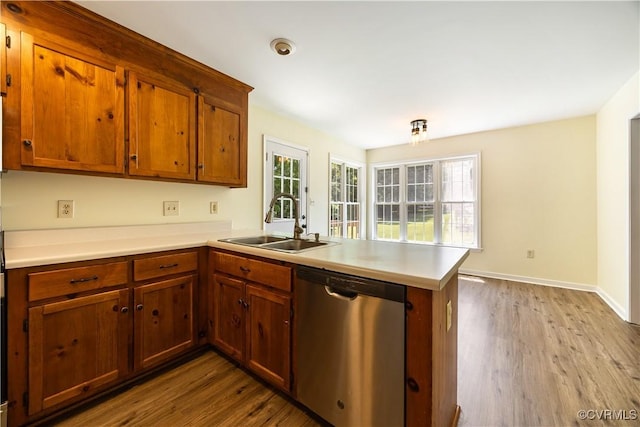 11556 New Forest Trl, Chesterfield, VA 23112 - kitchen featuring dishwasher, a peninsula, wood finished floors, and light countertops