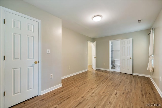 11556 New Forest Trl, Chesterfield, VA 23112 - unfurnished bedroom with light wood finished floors and connected bathroom