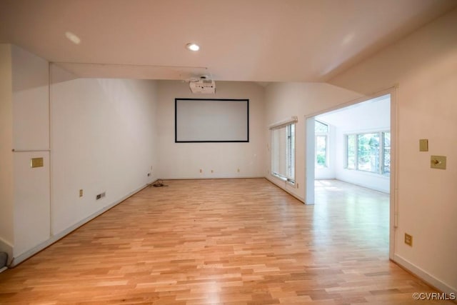 12931 River Hills Dr, Richmond, VA 23111 - empty room with vaulted ceiling, light wood-style flooring, and recessed lighting