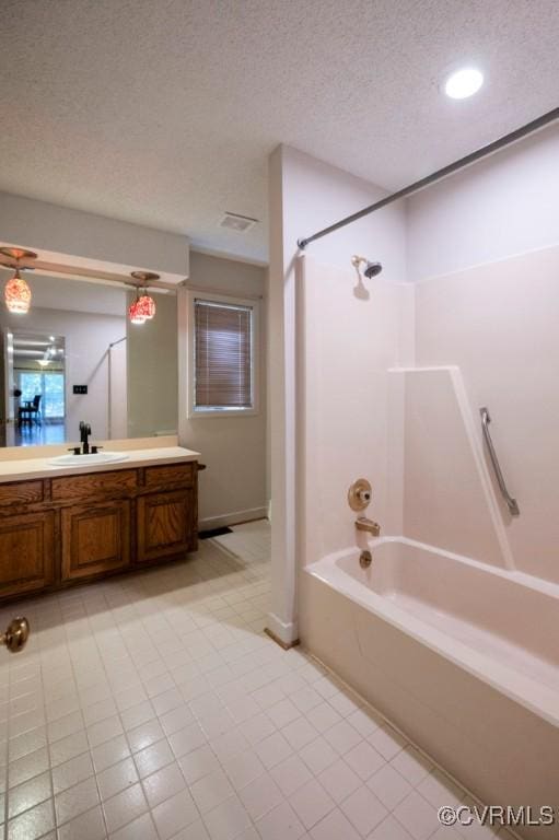 12931 River Hills Dr, Richmond, VA 23111 - bathroom with shower / tub combination, vanity, a textured ceiling, recessed lighting, and tile patterned flooring