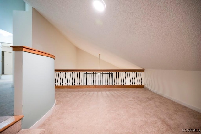 12931 River Hills Dr, Richmond, VA 23111 - bonus room featuring carpet floors, vaulted ceiling, and a textured ceiling