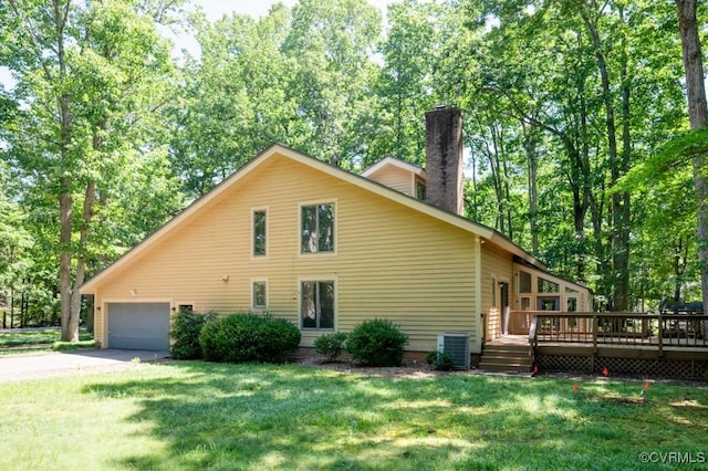 12931 River Hills Dr, Richmond, VA 23111 - view of front of house featuring a chimney, a deck, driveway, a front yard, and a garage