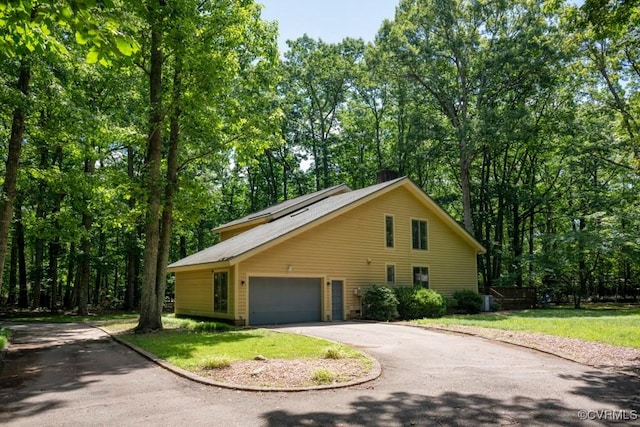 12931 River Hills Dr, Richmond, VA 23111 - view of front of property with driveway, a front lawn, a garage, and a chimney