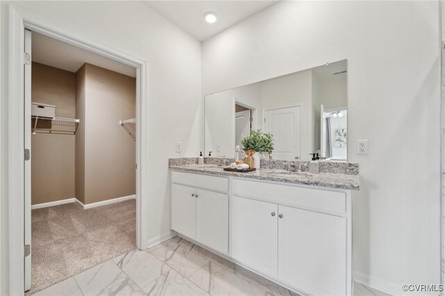 6112 Whisperwood Dr, Chesterfield, VA 23234 - full bath with double vanity, a spacious closet, and marble look tile flooring