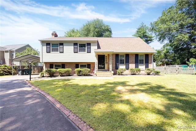 9201 Claymont Dr, Henrico, VA 23229 - tri-level home with a carport, a chimney, and brick siding