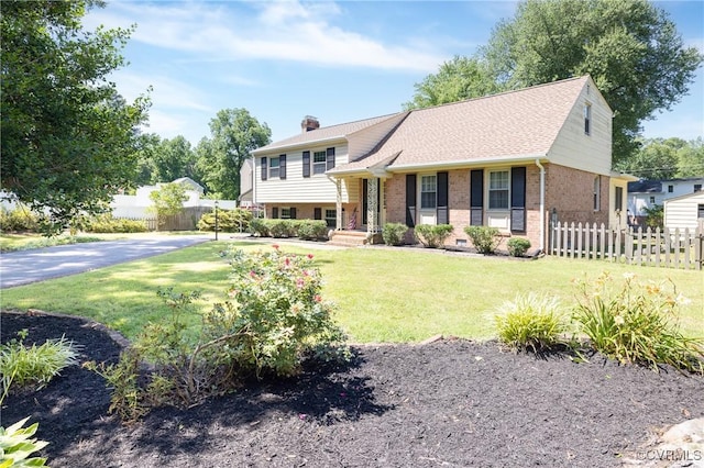 9201 Claymont Dr, Henrico, VA 23229 - split level home with brick siding and a chimney