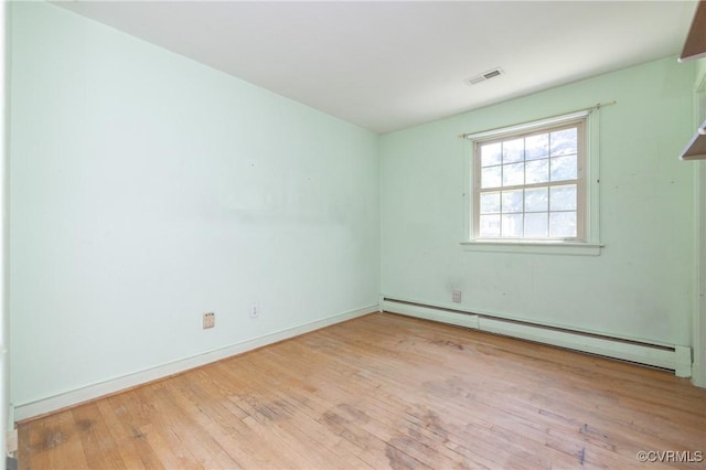 9201 Claymont Dr, Henrico, VA 23229 - unfurnished room with a baseboard heating unit and wood-type flooring