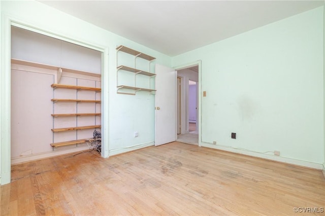 9201 Claymont Dr, Henrico, VA 23229 - unfurnished bedroom with wood finished floors and baseboards