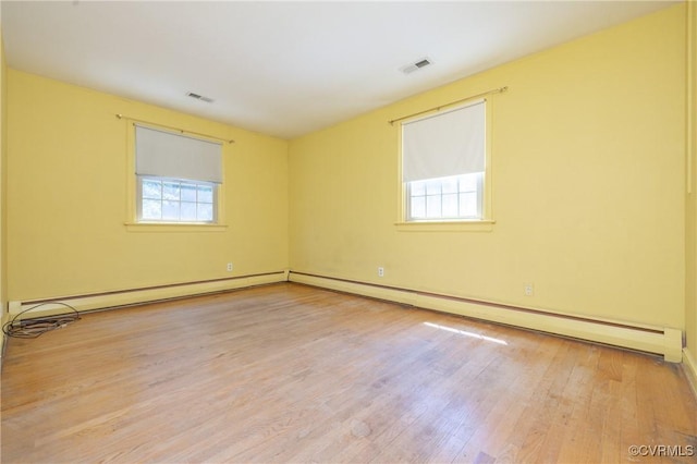 9201 Claymont Dr, Henrico, VA 23229 - empty room featuring light wood-style floors and a baseboard radiator