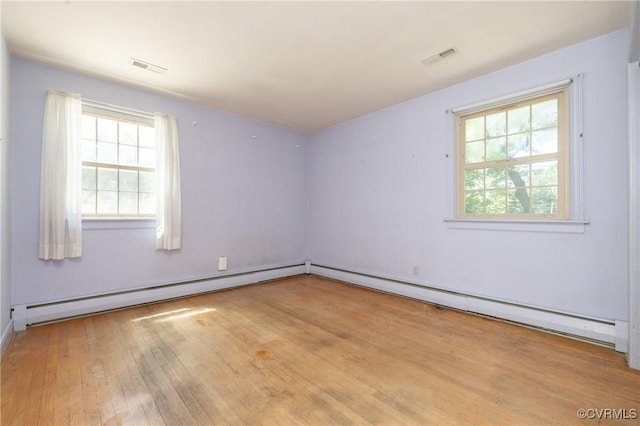 9201 Claymont Dr, Henrico, VA 23229 - spare room with a baseboard radiator, plenty of natural light, wood finished floors, and a baseboard heating unit