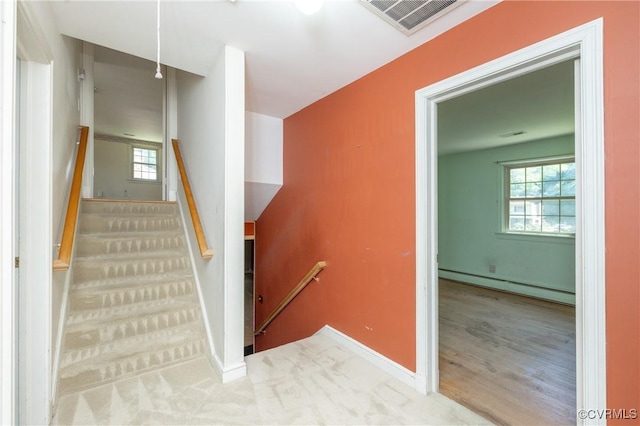 9201 Claymont Dr, Henrico, VA 23229 - staircase featuring a baseboard heating unit, healthy amount of natural light, and wood finished floors