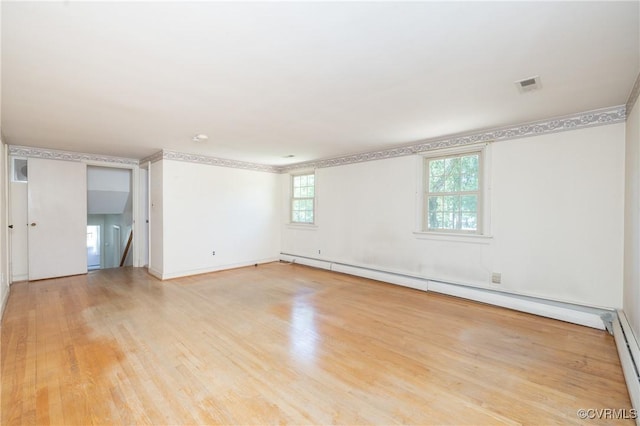 9201 Claymont Dr, Henrico, VA 23229 - spare room featuring light wood-type flooring and a baseboard heating unit