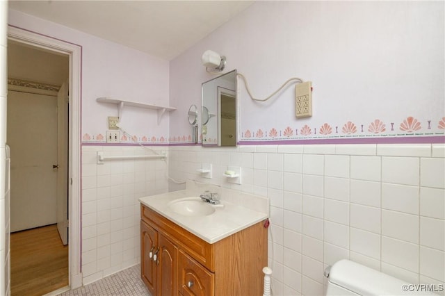 9201 Claymont Dr, Henrico, VA 23229 - bathroom featuring vanity, tile walls, and a wainscoted wall