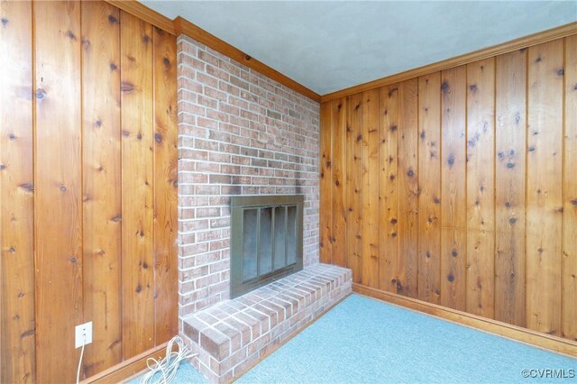 9201 Claymont Dr, Henrico, VA 23229 - unfurnished living room with a fireplace, carpet flooring, and wood walls