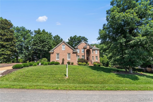 3105 Sapling Dr, Toano, VA 23168 - colonial-style house featuring brick siding and a front yard