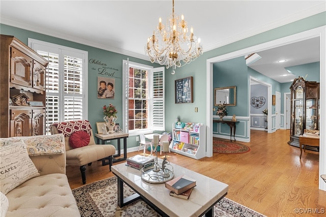 3105 Sapling Dr, Toano, VA 23168 - living area featuring crown molding, light wood-type flooring, and a chandelier