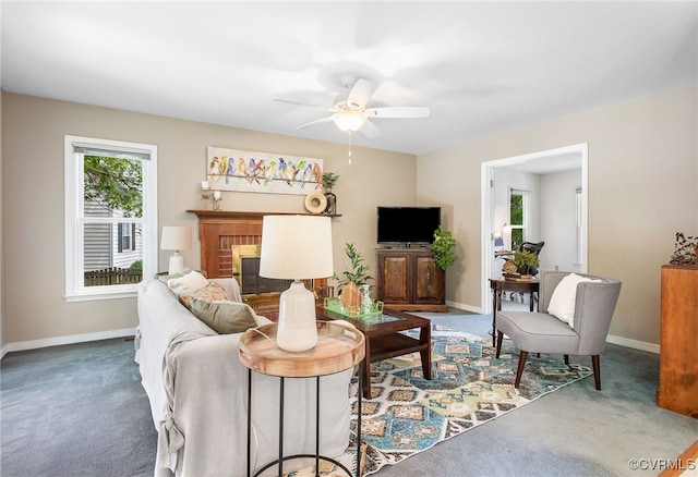 9154 Jump Cir, Mechanicsville, VA 23116 - carpeted living room with a ceiling fan and a brick fireplace