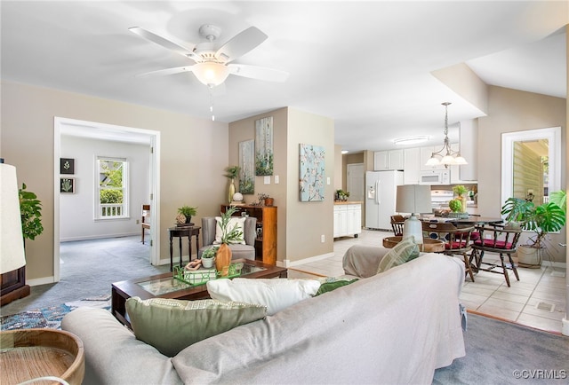 9154 Jump Cir, Mechanicsville, VA 23116 - living room with ceiling fan, light carpet, and a chandelier
