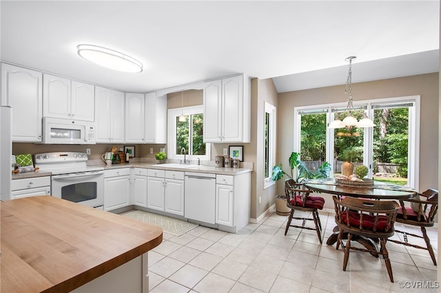 9154 Jump Cir, Mechanicsville, VA 23116 - kitchen featuring white appliances, healthy amount of natural light, a chandelier, and pendant lighting
