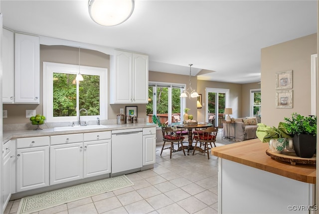 9154 Jump Cir, Mechanicsville, VA 23116 - kitchen featuring dishwasher, white cabinetry, decorative light fixtures, light tile patterned floors, and open floor plan