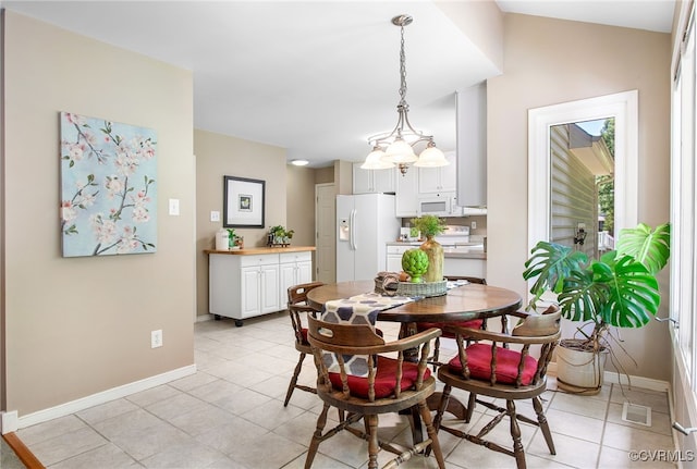 9154 Jump Cir, Mechanicsville, VA 23116 - dining room with light tile patterned floors and a chandelier