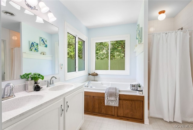 9154 Jump Cir, Mechanicsville, VA 23116 - bathroom featuring a shower with shower curtain, double vanity, and a garden tub