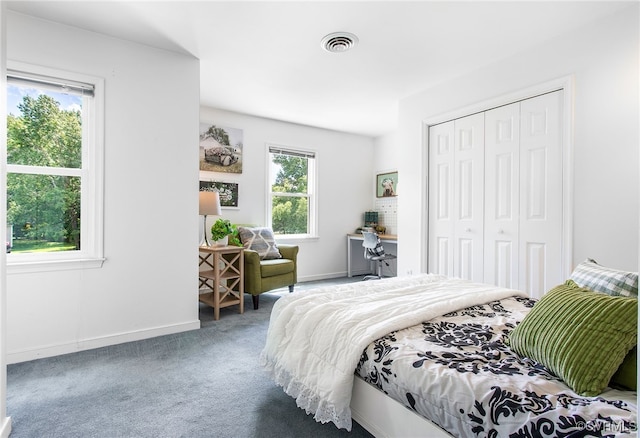 9154 Jump Cir, Mechanicsville, VA 23116 - carpeted bedroom featuring a closet and baseboards