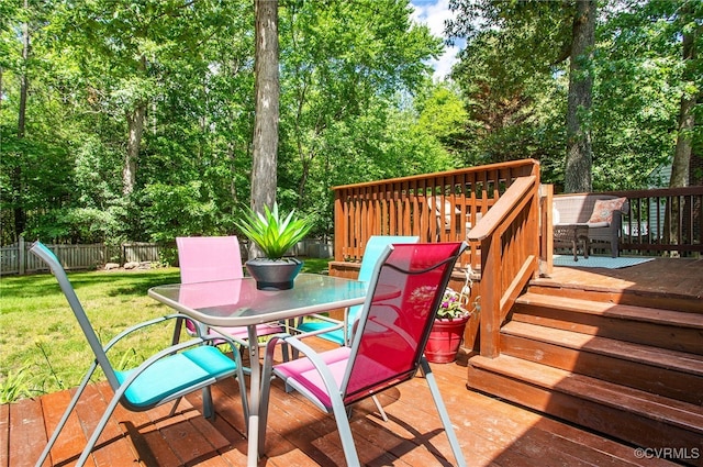 9154 Jump Cir, Mechanicsville, VA 23116 - wooden terrace featuring outdoor dining area, a fenced backyard, and view of scattered trees