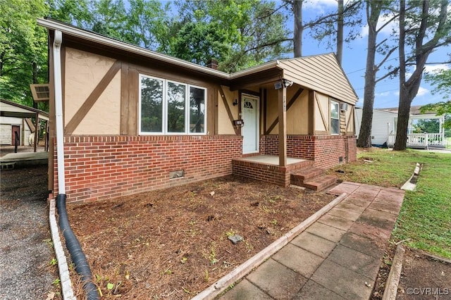 507 Tavern St, Blackstone, VA 23824 - tudor-style house with brick siding, stucco siding, and crawl space
