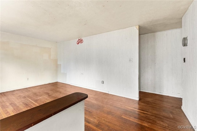 507 Tavern St, Blackstone, VA 23824 - unfurnished room featuring wood finished floors and wood walls