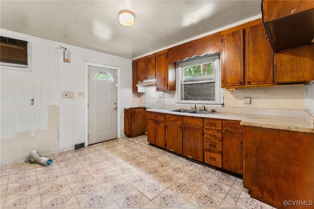 507 Tavern St, Blackstone, VA 23824 - kitchen with light countertops, brown cabinets, light floors, and a wall mounted air conditioner