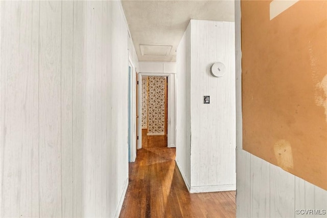 507 Tavern St, Blackstone, VA 23824 - hall with wood-type flooring, attic access, and wood walls