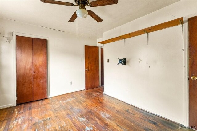 507 Tavern St, Blackstone, VA 23824 - unfurnished bedroom with hardwood / wood-style flooring, a closet, and ceiling fan