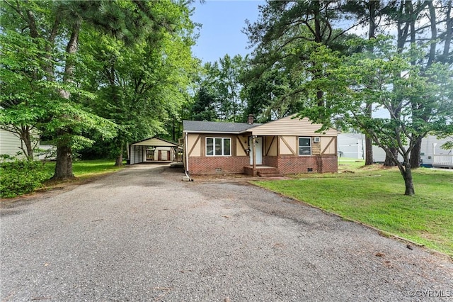 507 Tavern St, Blackstone, VA 23824 - view of front of house with asphalt driveway, a front yard, a carport, crawl space, and brick siding