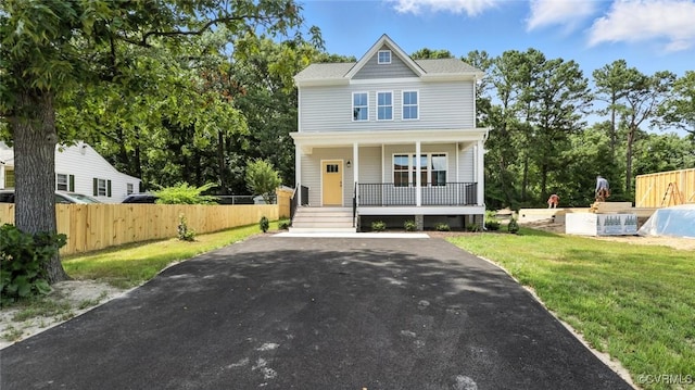 2916 Congress Rd, North Chesterfield, VA 23237 - view of front of property featuring covered porch, driveway, and view of wooded area