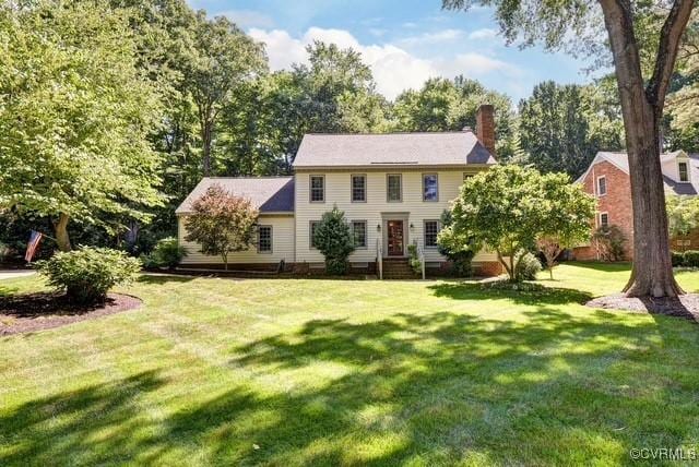 305 E Tazewells Way, Williamsburg, VA 23185 - colonial-style house with a chimney, a front yard, and entry steps