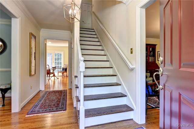 305 E Tazewells Way, Williamsburg, VA 23185 - stairs with wood finished floors, ornamental molding, and a chandelier
