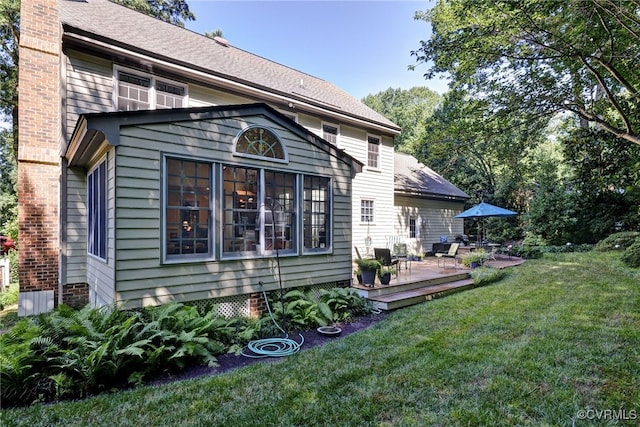 305 E Tazewells Way, Williamsburg, VA 23185 - rear view of house with a wooden deck, a lawn, and a chimney
