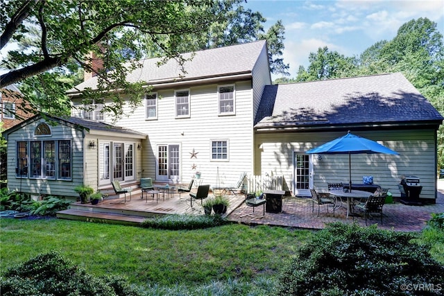 305 E Tazewells Way, Williamsburg, VA 23185 - rear view of house with a wooden deck, a yard, and a chimney