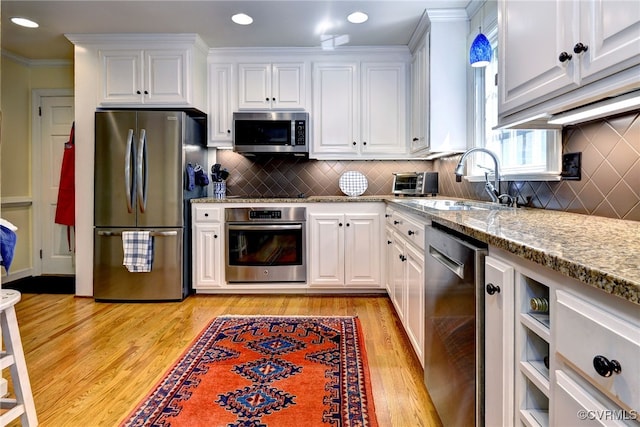 305 E Tazewells Way, Williamsburg, VA 23185 - kitchen featuring stainless steel appliances, white cabinets, light stone countertops, light wood-type flooring, and recessed lighting