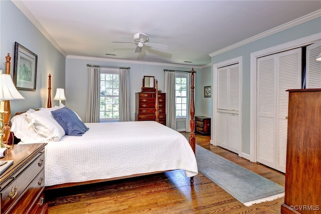 305 E Tazewells Way, Williamsburg, VA 23185 - bedroom with multiple windows, two closets, wood finished floors, ornamental molding, and ceiling fan
