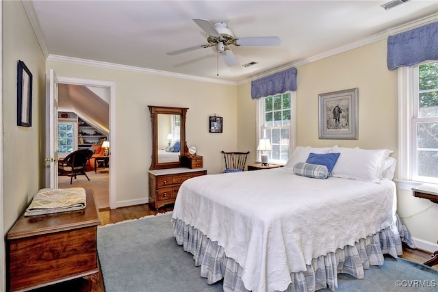 305 E Tazewells Way, Williamsburg, VA 23185 - bedroom featuring multiple windows, wood finished floors, crown molding, and ceiling fan